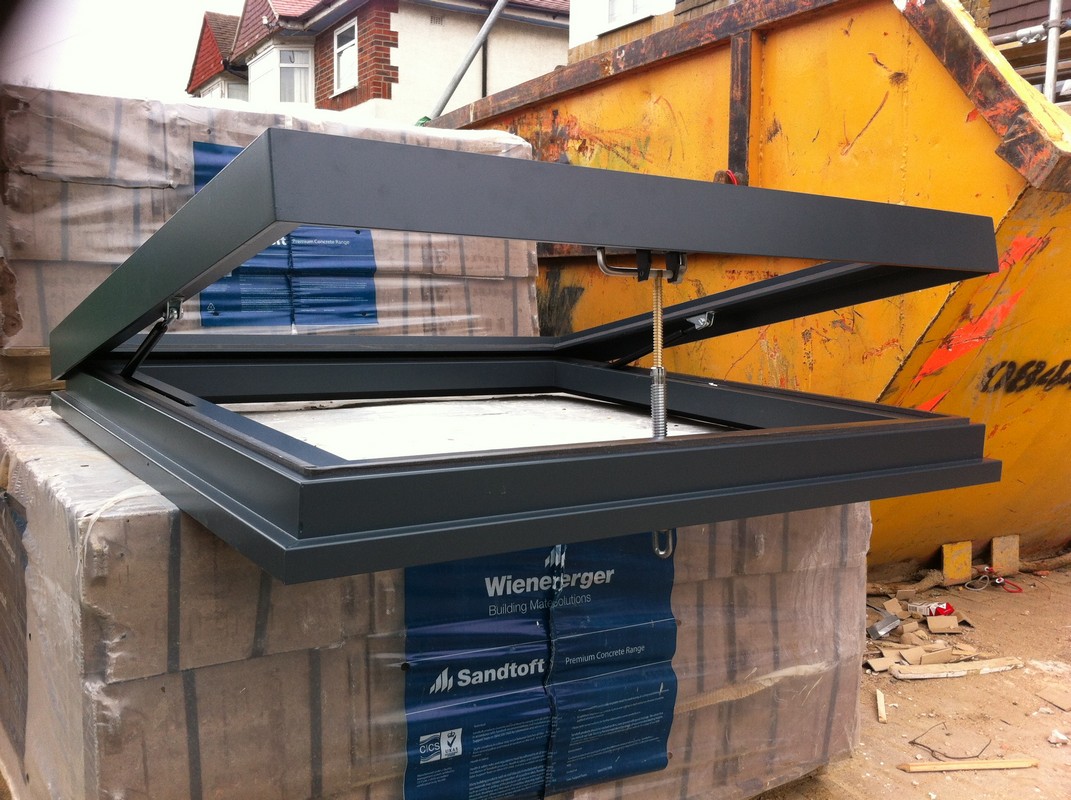 Opening flat roof skylight in anthracite grey installed in Greenwich