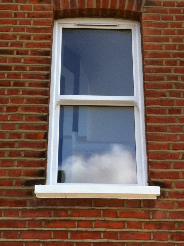 uPVC sash window on Victorian red brick house in Greenwich